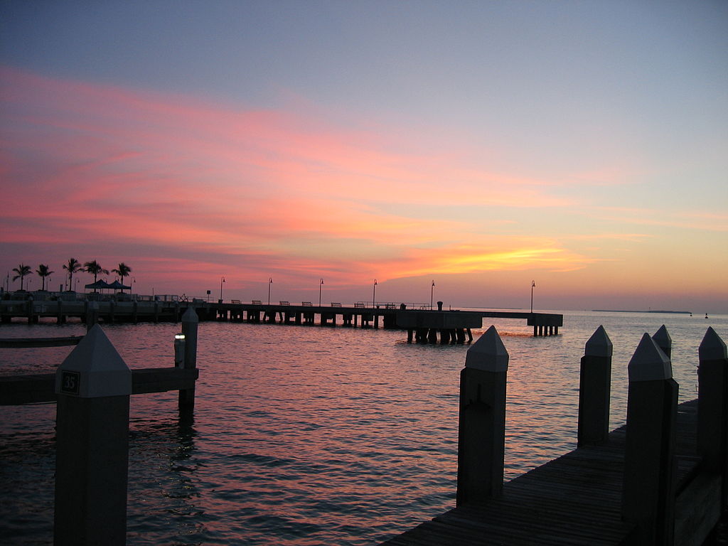 Beautiful sunset with orange and yellow hues overlooking the warm waters in Key West, Florida