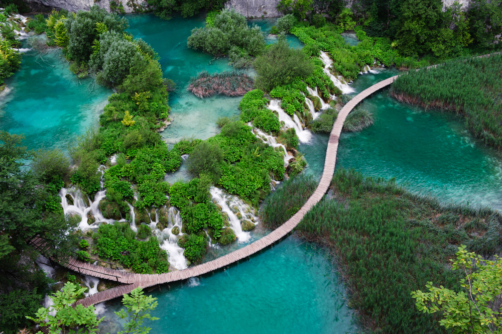 Aerial view of a series of waterfalls in Plitvice Lakes National Park, the largest national park in Croatia and the oldest in Southeast Europe. It was founded in 1949 and extends over approximately 300 square kilometers; spectacular scenery!