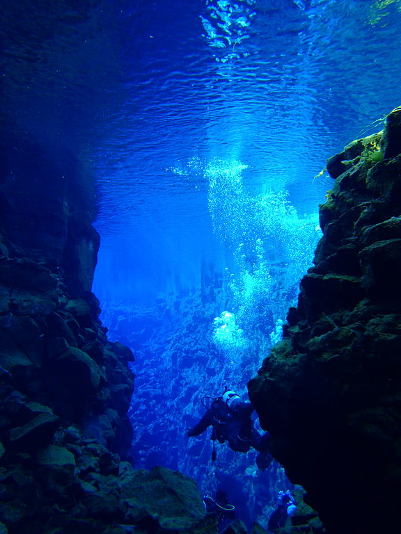 Scuba diver explores the Silfra Rift on Lake Thingvellir in Iceland