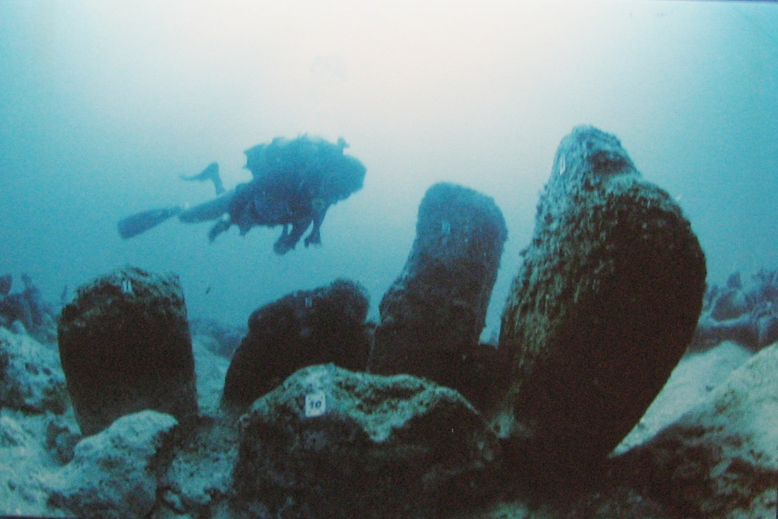 Diver exploring a ritual structure made of stones at Isreal's Atlit-Yam