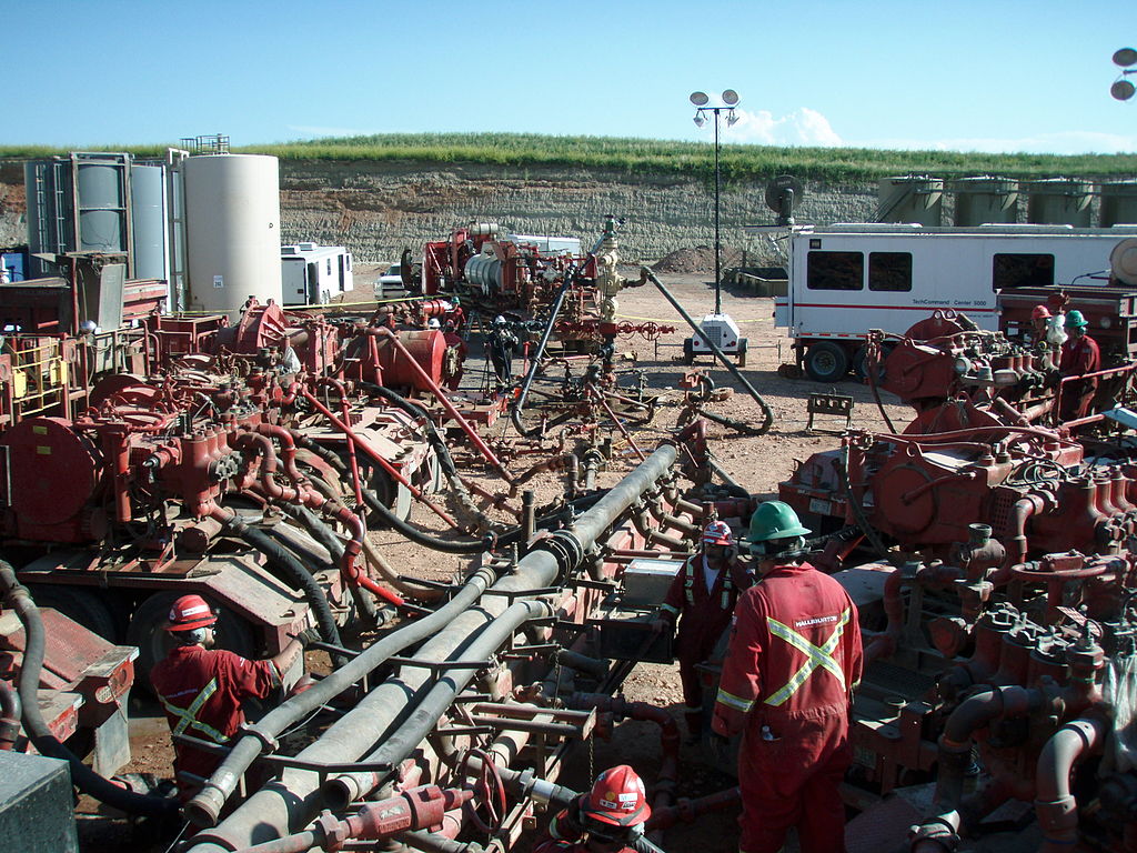 Workers continue to perform their daily duties on a fracking job already in progress at North Dakota's Bakken Formation