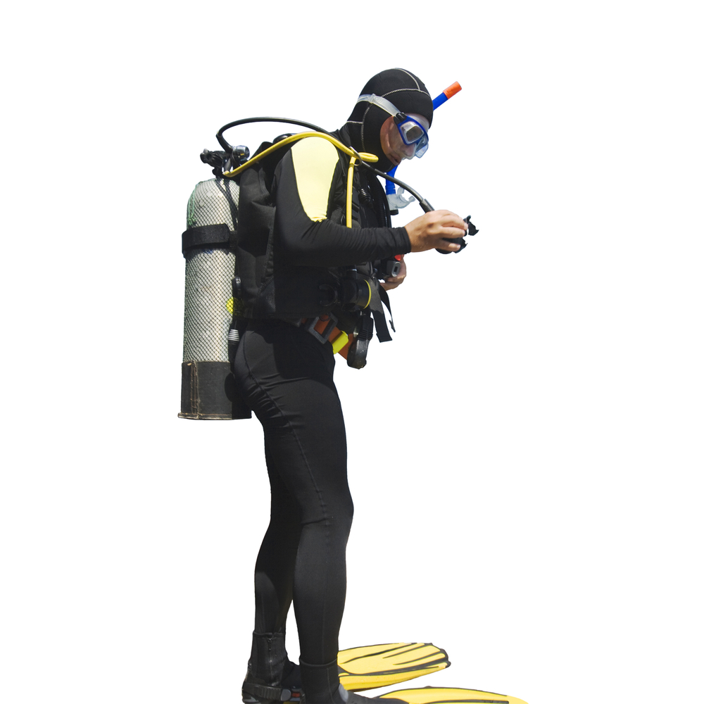 Male scuba diver examines his gear before heading out on his next dive trip
