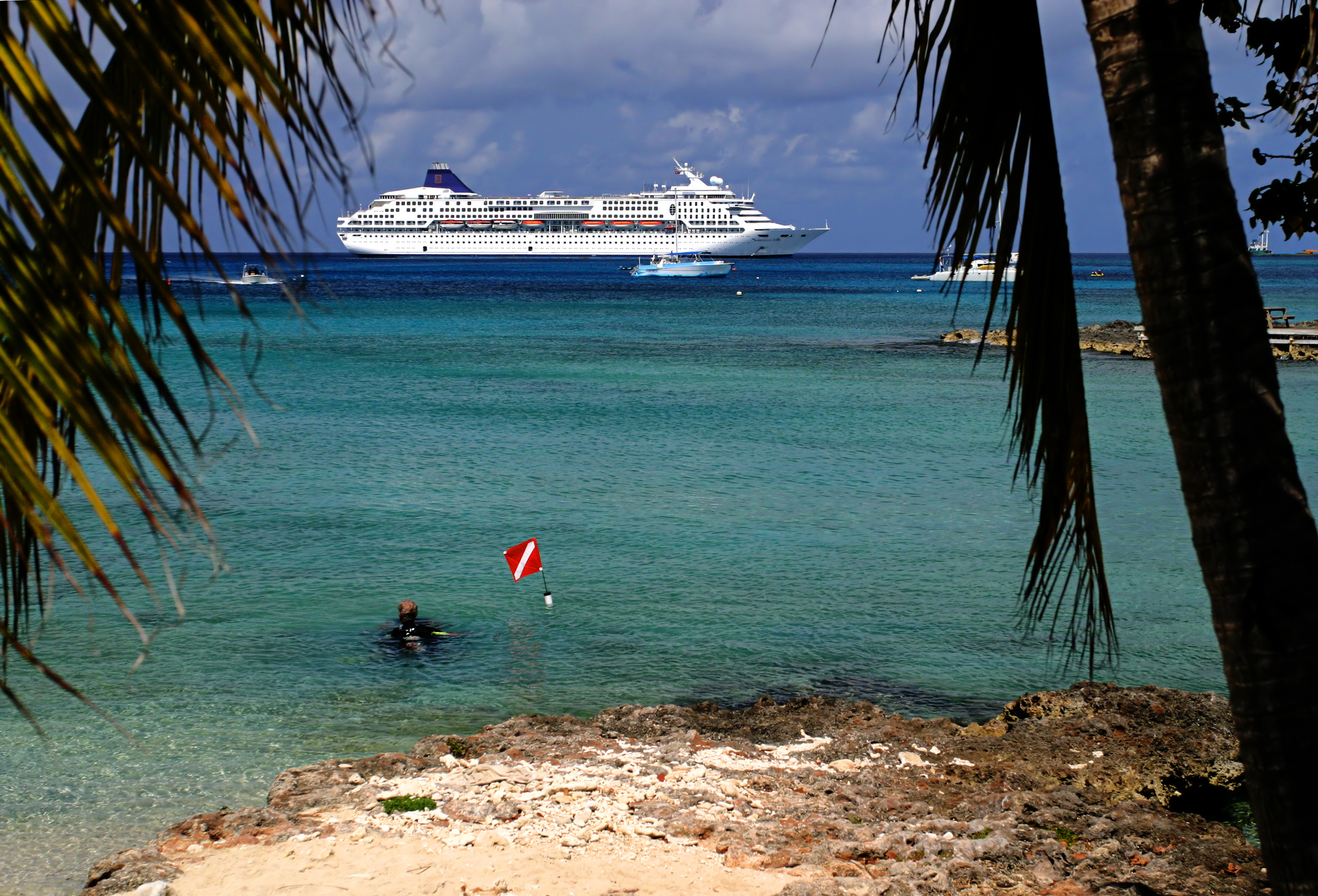 Several divers on a Caribbean cruise ship enjoy a shore diving excursion