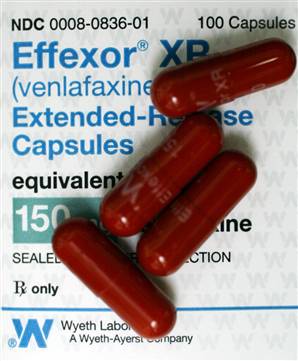 Four effexor pills atop the prescription label