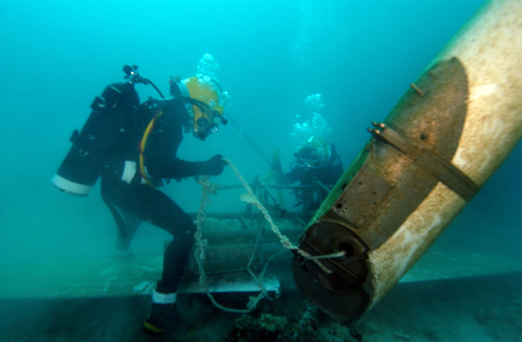 Several divers utilize mobile underwater salvage unit in Pearl Harbor, Hawaii for training exercises
