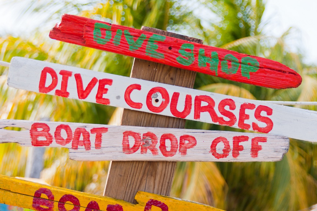 Sign along the beach directing divers to the cave diving course that is about to start