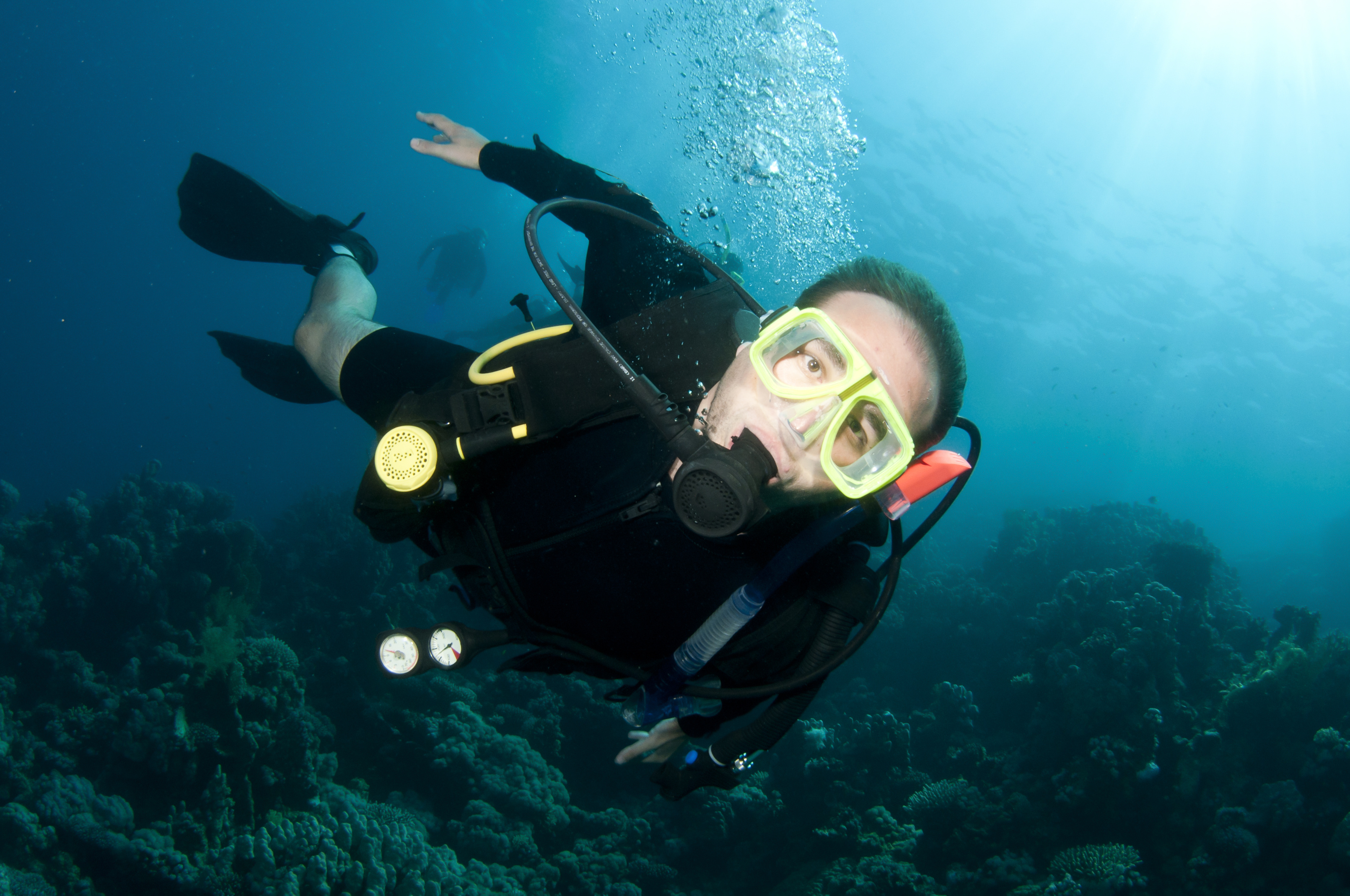 Male diver suffering from hyperventilation while on a dive