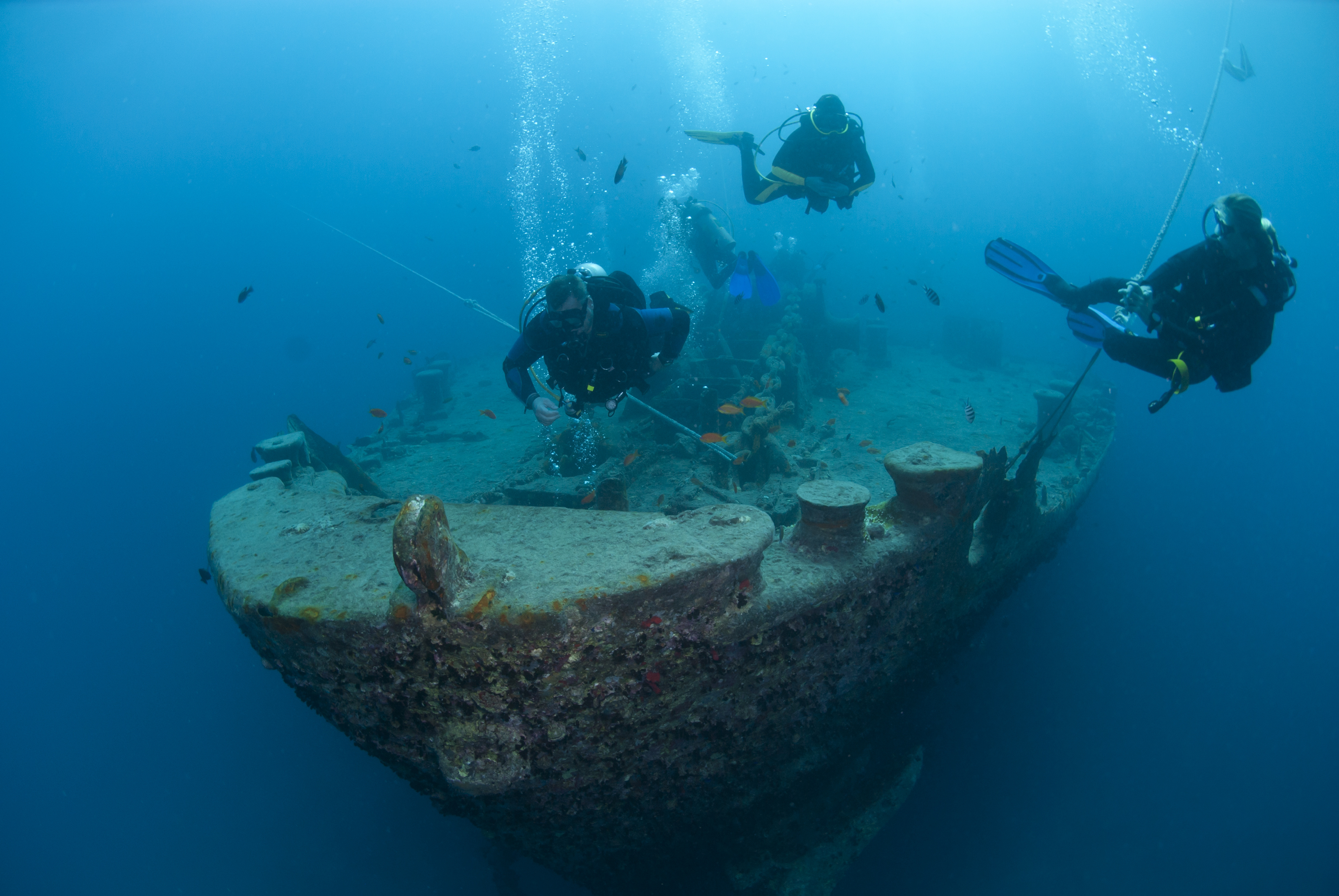 Wreck diver instructor and two students make their way back to the surface after practicing some navigation skills