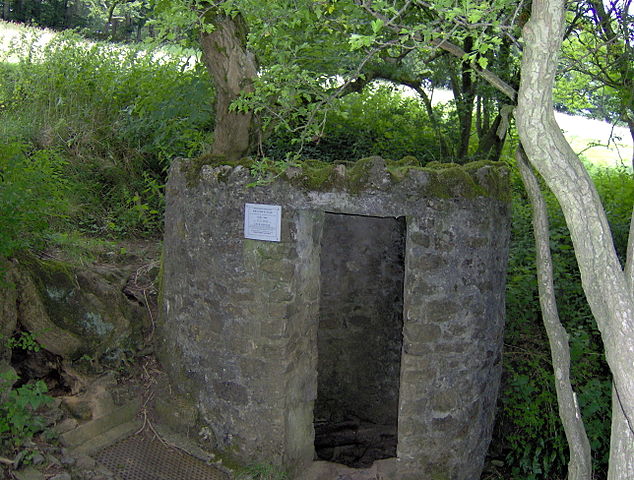 The concrete and rock structure marking one of the entrances to England&#039;s Swildon&#039;s Hole, a popular site among early cave diving pioneers