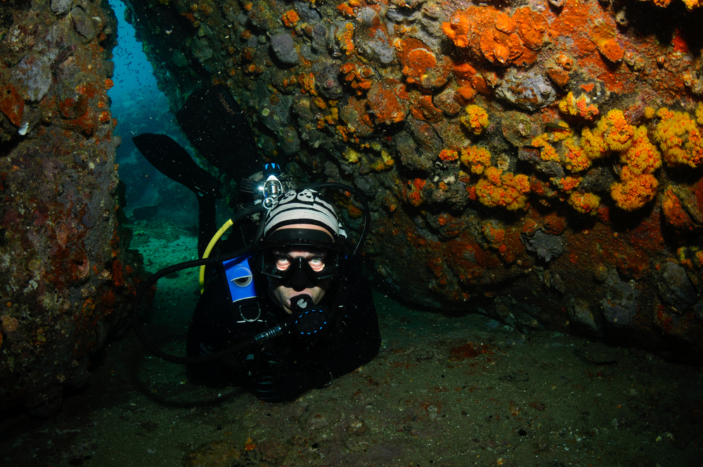Mentally prepared cave diver enters tight spaces