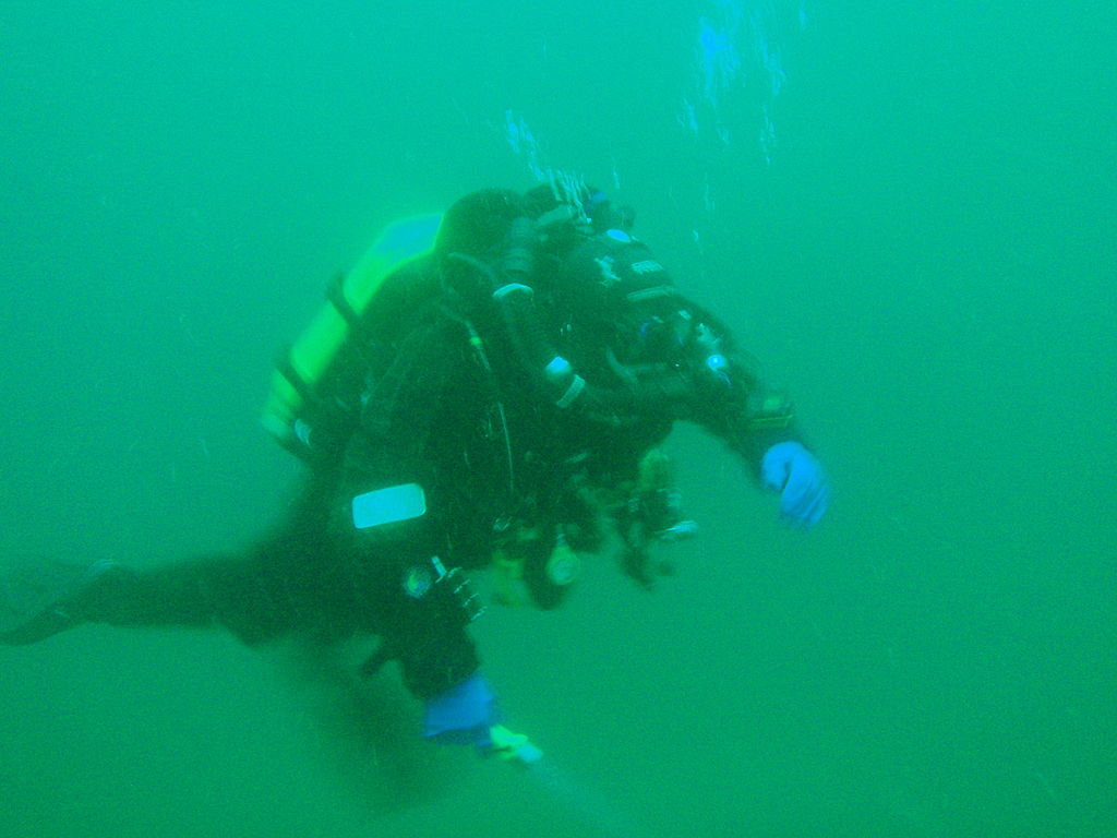 Rebreather diver in full gear makes his way underwater to examine MV Oratova wreck