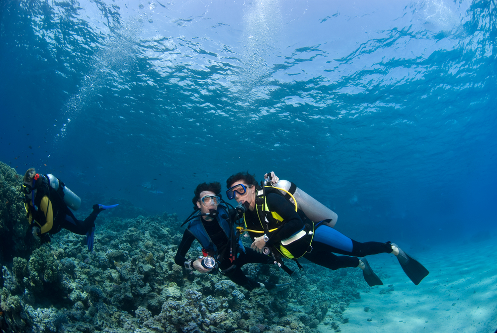 Two divers practice their buoyancy control skills enabling them more bottom time with reduced air consumption