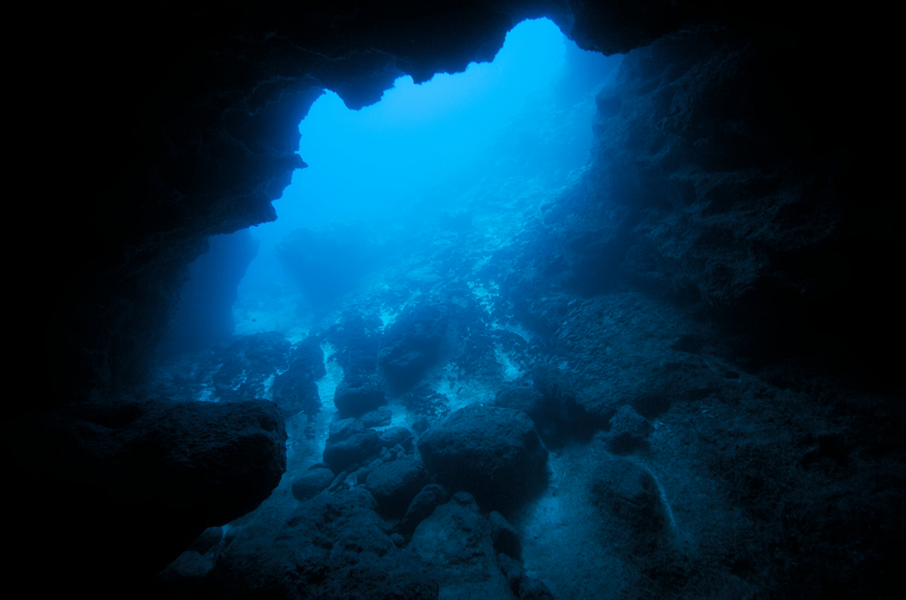 An underwater cavern viewed from the diver exiting the cavern