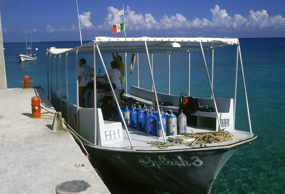 A dive boat captain and crew make final preparations on the boat before the divers arrive