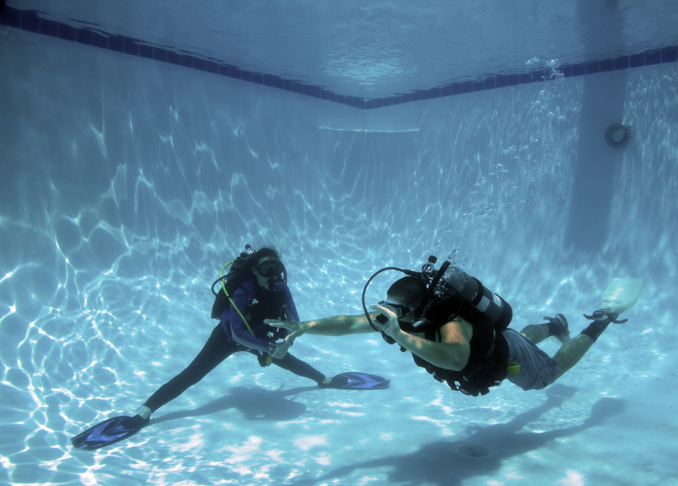 Dive instructor begins open water training exercises with a new group of dive trainees