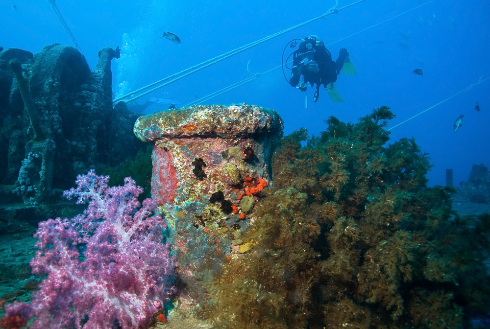 Underwater photographer captures images of an wreck to be used later for mapping purposes