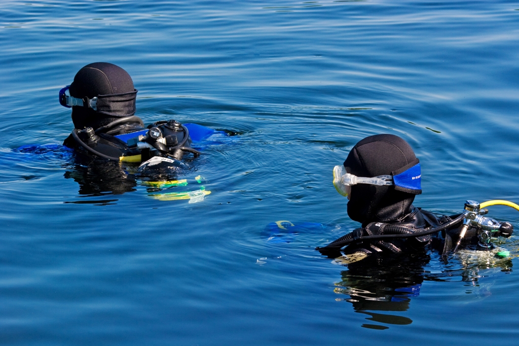 Two divers ready to descend for a dive at Maine&#039;s Moosehead Lake