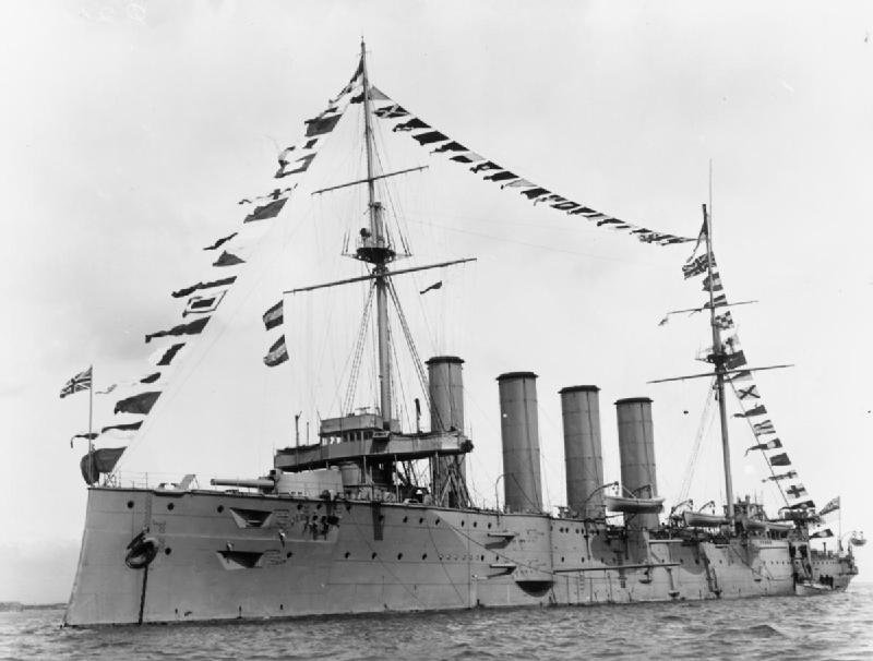 The HMS Drake wreck sits atop the water bearing the British flag before being sunk in 1917 after being struck by torpedoes