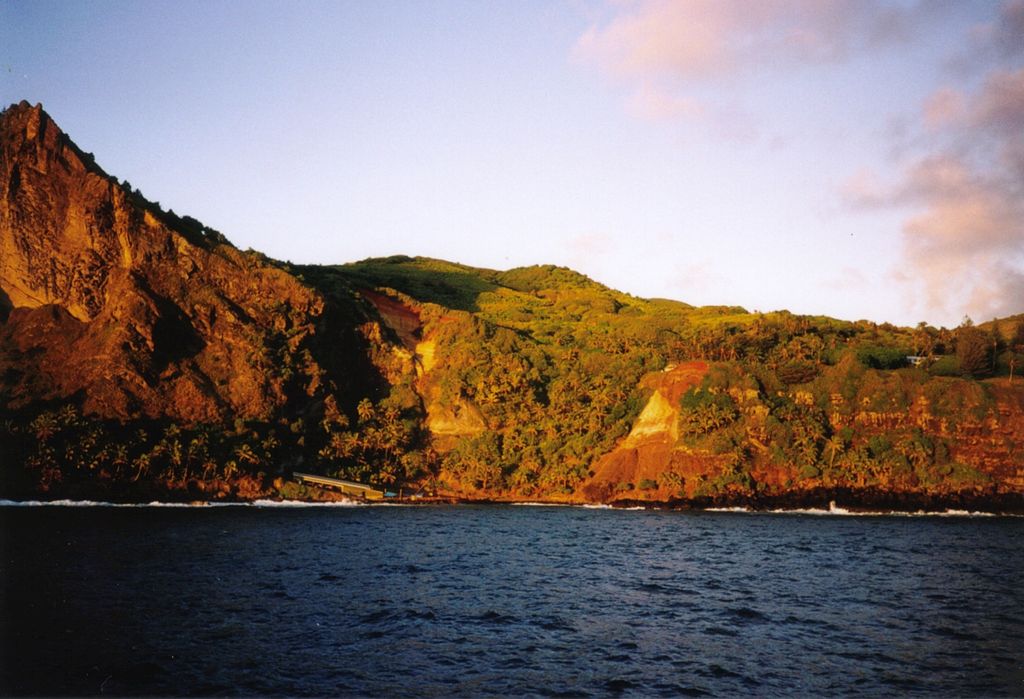 Bounty Bay on Pitcairn Island is home to lush green forests topside and schools of predatory fish below the waterline