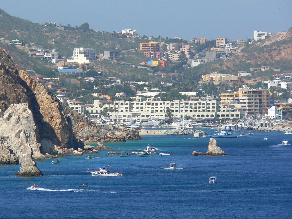 Picturesque view of the bay of Cabo San Lucas with active water sports enthusiasts 