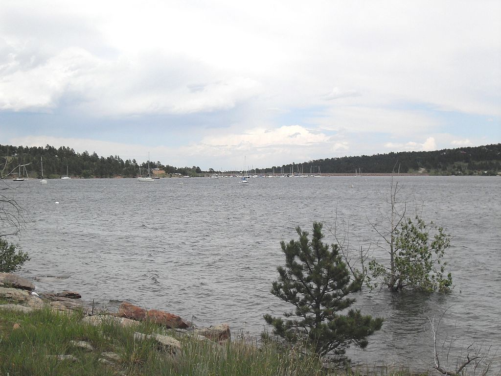 Panoramic view of Colorado's Carter Lake with a collection of sailboats in the backdrop