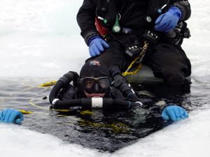 Two ice divers set up to explore the cold waters of Hokkaido Island in Japan