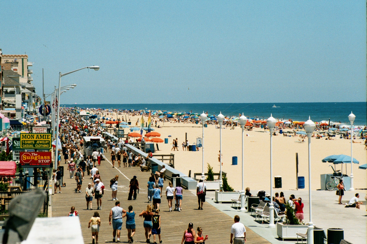 Busy pier and gorgeous beach are surrounded by the blue waters that hold numerous shipwrecks in Ocean City, Maryland