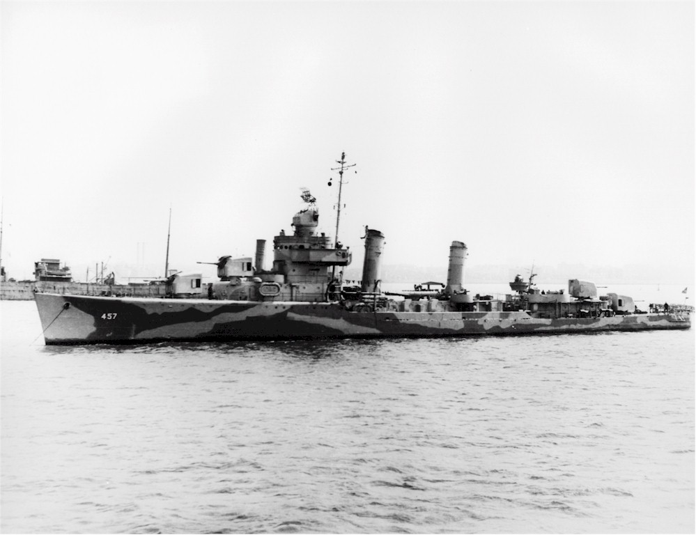 The USS Emmons painted in camouflage at anchor in 1942 before being hit by a kamikaze in 1945