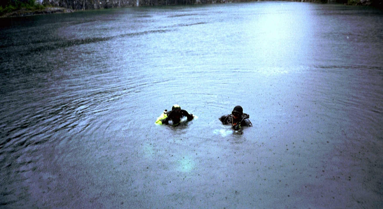 Two divers at Vagnharad Limestone Quarry in Sweden prepare to take the plunge to explore "The Throne".