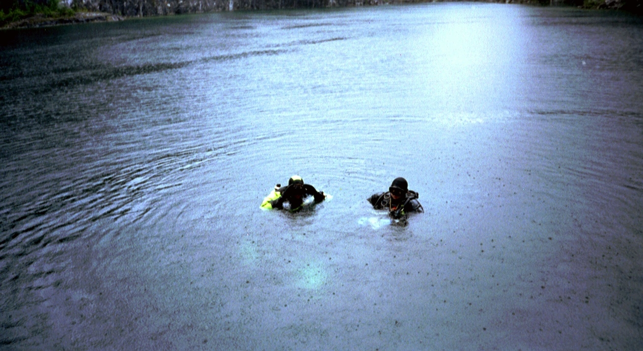 Two divers at Vagnharad Limestone Quarry in Sweden prepare to take the plunge to explore &quot;The Throne&quot;.
