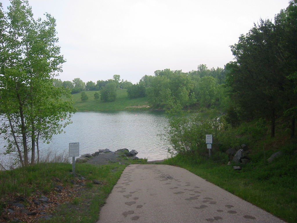 Scuba diving ramp surrounded by lush greenery leads divers down to Wazee Lake in Wisconsin 