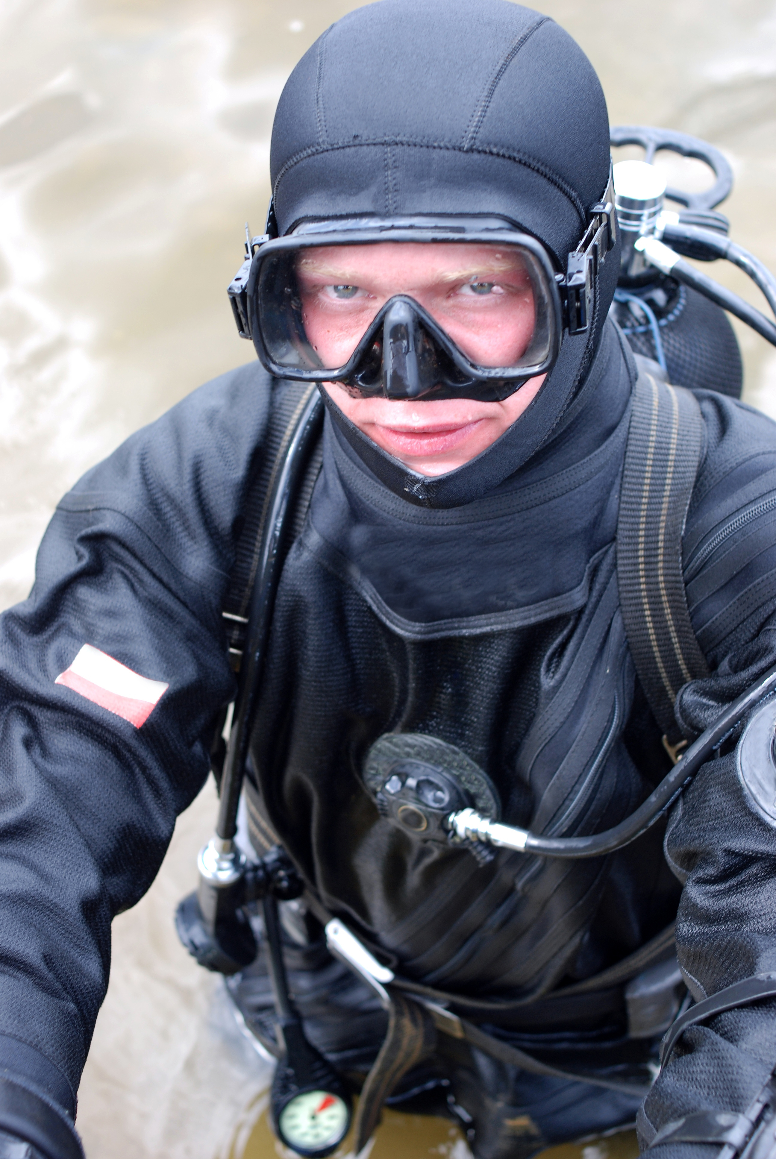 Male diver prepares to enter the chilly waters in Minnesota where the infamous Crosby Mines are located