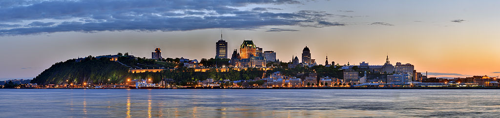 Panoramic view of the city of Quebec at sunset surrounding by water
