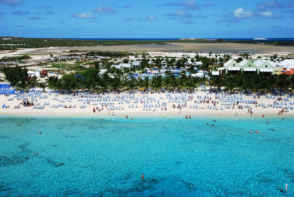 Pristine blue waters of the Caribbean welcome visitors to the beautiful ivory sand beaches of Grand Turk in the Turks and Caicos Islands