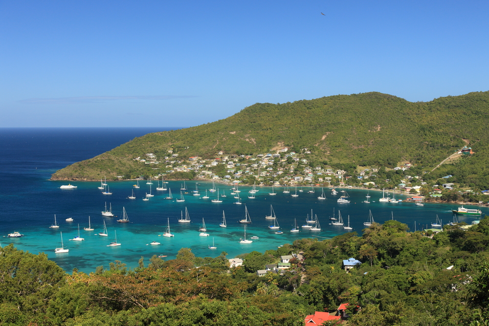 Picturesque view of tropical bay with sailboats on Bequia Island in the Caribbean waters of Saint Vincent and the Grenadines