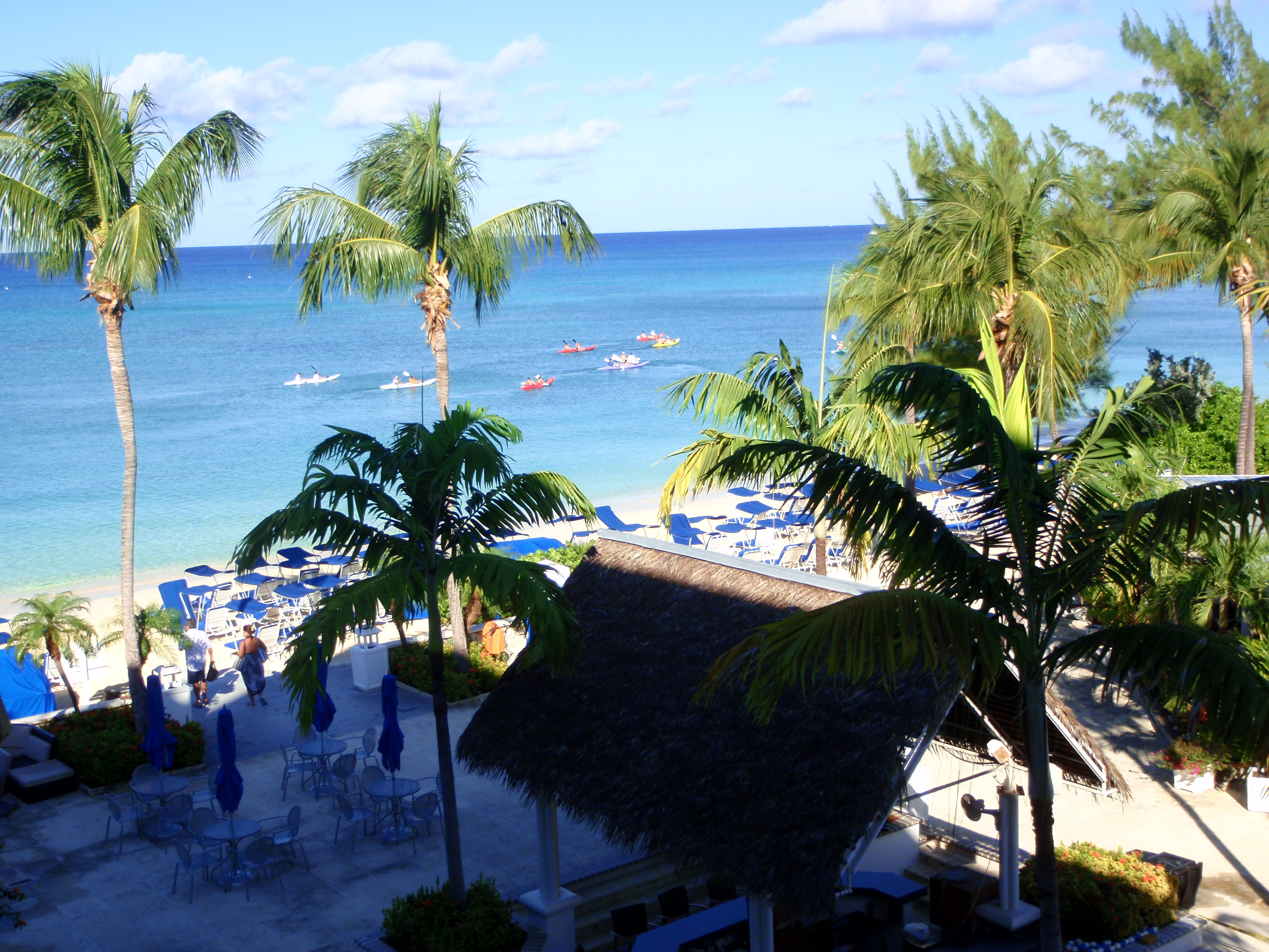 group of kayakers get a fantastic workout as they explore grand cayman's seven mile beach